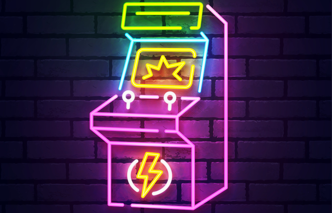 Neon light arcade cabinet over brick wall